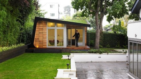 A bespoke garden retreat nestled amongst the trees completed of sedum roof and cedar tiles