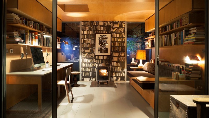 Bespoke outdoor office with wood burner and roof window